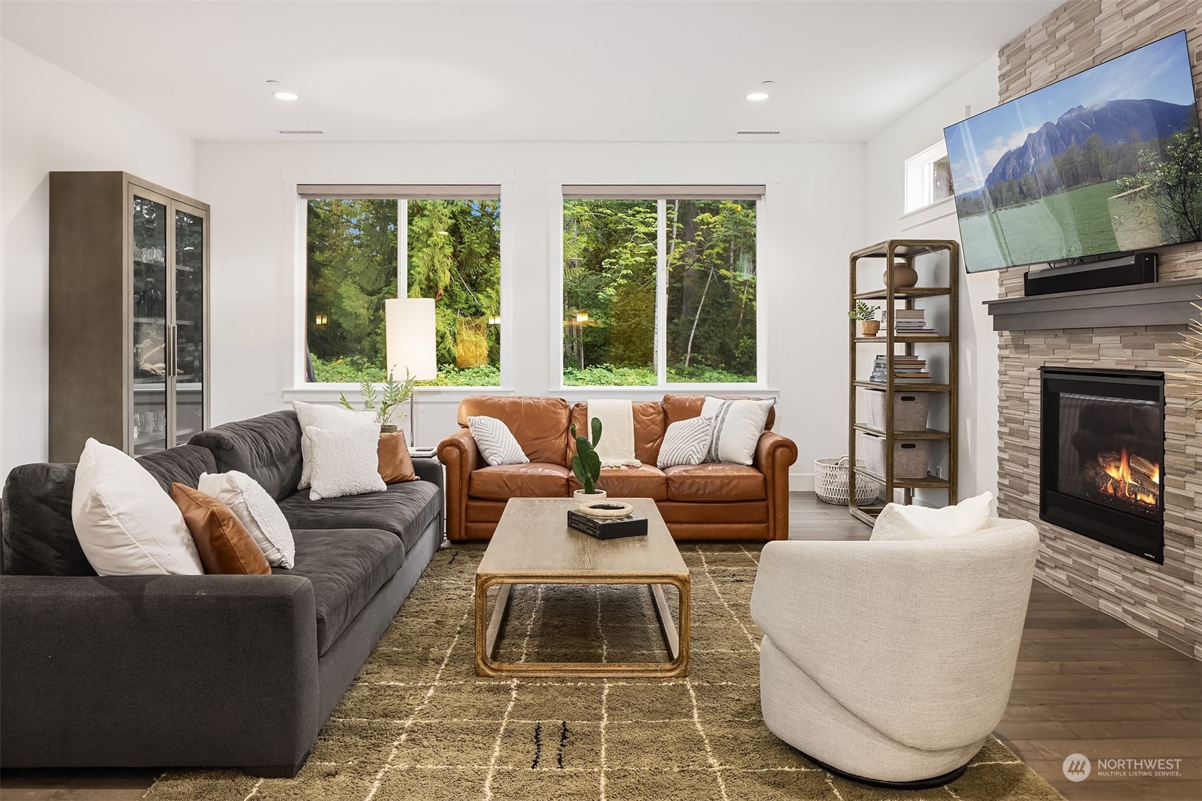 36234 Southeast Fish Hatchery Road Fall City, WA 98024 - Photo 6 of 40 a living room with furniture a large window and a fireplace