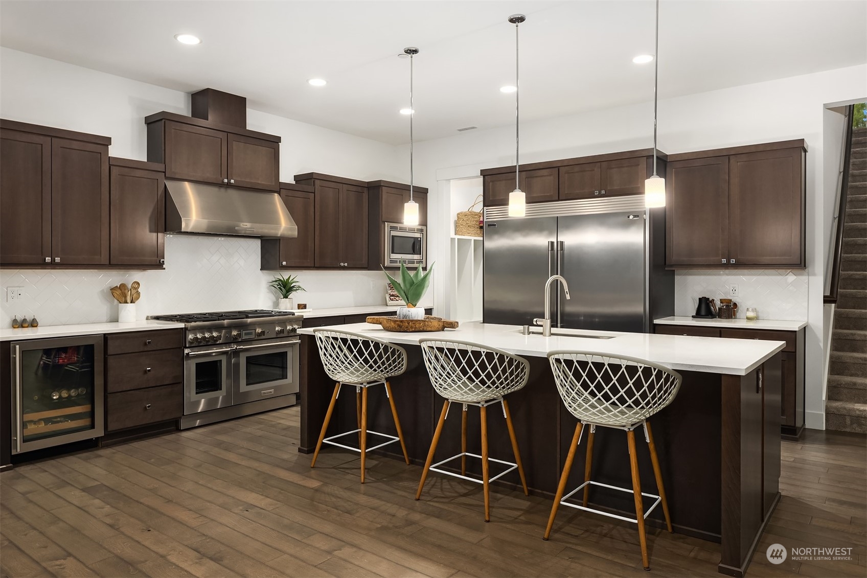 36234 Southeast Fish Hatchery Road Fall City, WA 98024 - Photo 8 of 40 a kitchen with stainless steel appliances granite countertop a sink a stove a refrigerator and chairs