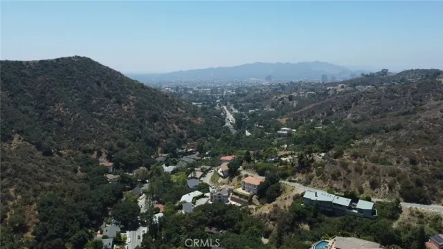 an aerial view of residential house and green space