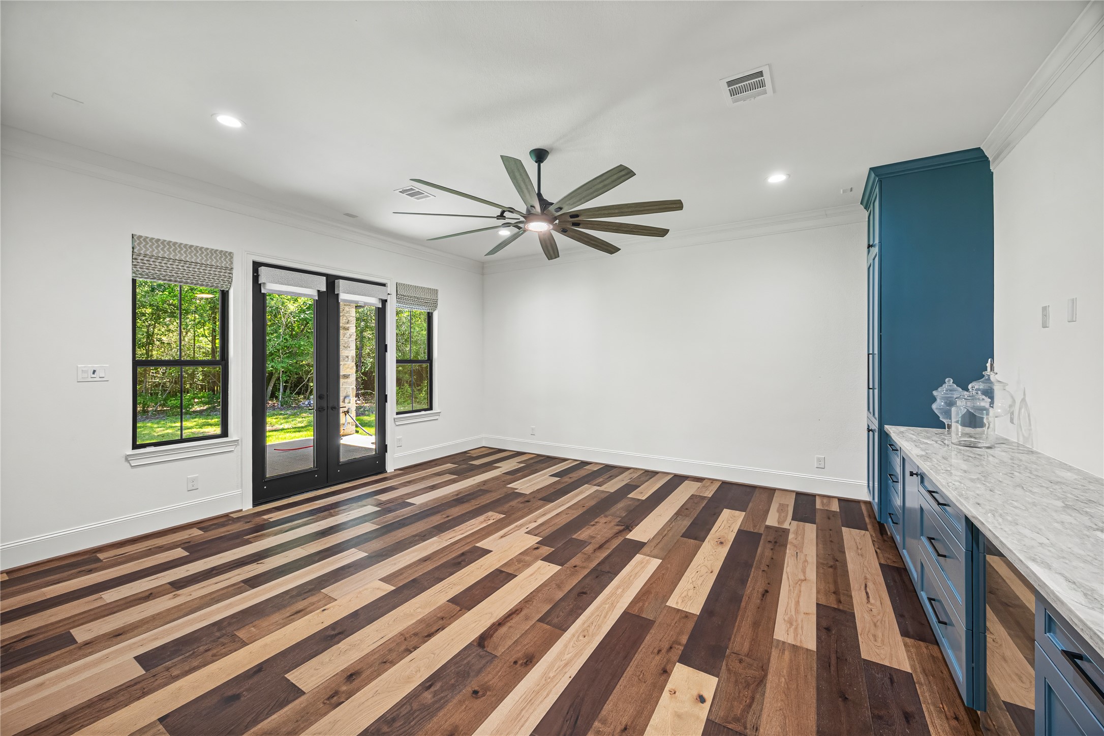 19314 Chateau Ridge Court Tomball, TX 77377 - Photo 38 of 50 Opening directly to the patio, this space delivers a true indoor-outdoor lifestyle that enriches the home’s flow and amplifies its entertaining potential.