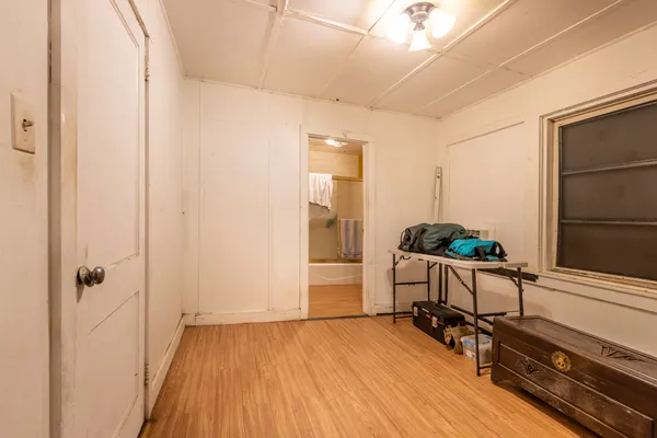 a room with furniture and wooden floor