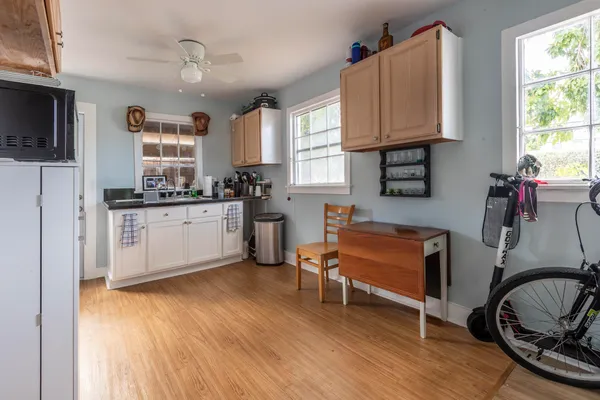 a kitchen with sink cabinets and window