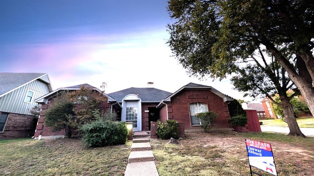 2129 Fawn Ridge Trail Carrollton, TX 75010 - Photo 1 of 30 View of front of property with brick siding and a front yard