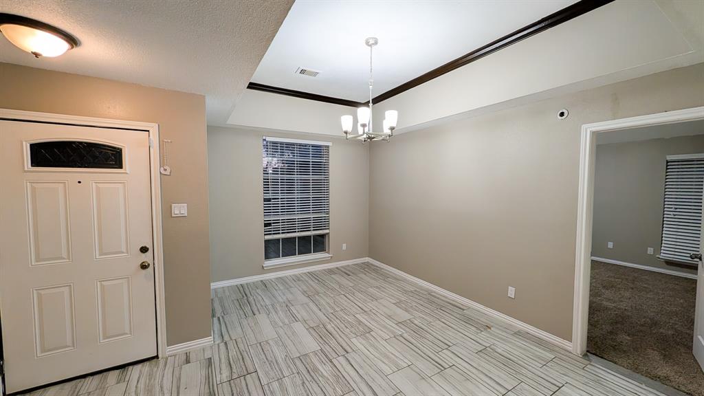 2129 Fawn Ridge Trail Carrollton, TX 75010 - Photo 15 of 30 wooden floor in an empty room with a window
