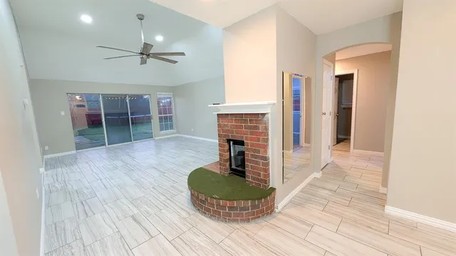 a bathroom with a granite countertop sink a mirror and a toilet