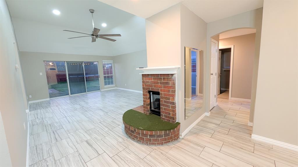 2129 Fawn Ridge Trail Carrollton, TX 75010 - Photo 17 of 30 a living room with furniture and a fireplace