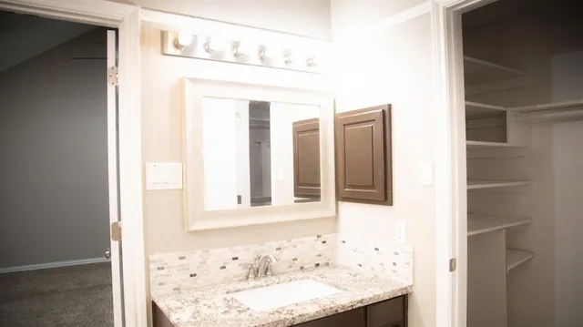 a bathroom with a tub and shower