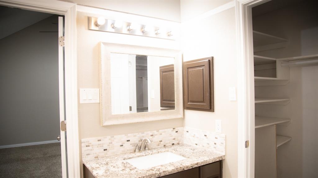2129 Fawn Ridge Trail Carrollton, TX 75010 - Photo 2 of 30 Bathroom featuring backsplash and vanity