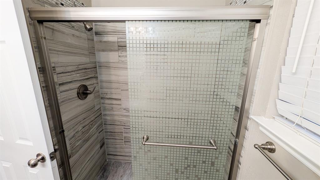 2129 Fawn Ridge Trail Carrollton, TX 75010 - Photo 23 of 30 a bathroom with a shower