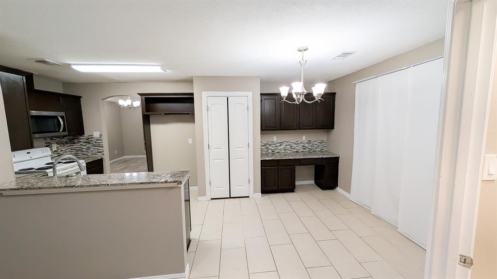 2129 Fawn Ridge Trail Carrollton, TX 75010 - Photo 27 of 30 a bathroom with a double vanity sink and a mirror