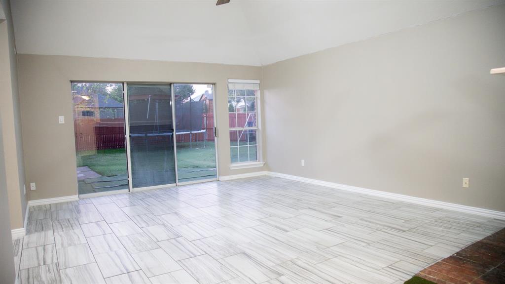 2129 Fawn Ridge Trail Carrollton, TX 75010 - Photo 10 of 30 a view of an empty room with floor to ceiling window