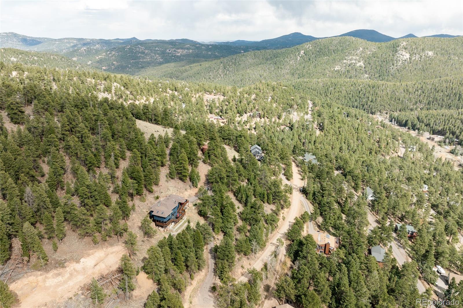7290 Timber Trail Road Evergreen, CO 80439 - Photo 10 of 11 a view of lake with mountain