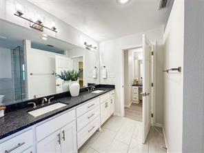 3952 Tin Top Road Weatherford, TX 76087 - Photo 27 of 39 a spacious bathroom with a granite countertop sink mirror and a shower
