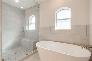 3952 Tin Top Road Weatherford, TX 76087 - Photo 28 of 39 a white bath tub sitting next to a window