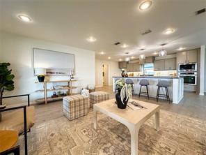 3952 Tin Top Road Weatherford, TX 76087 - Photo 32 of 39 a living room with furniture and kitchen view