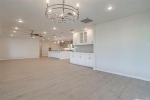 3952 Tin Top Road Weatherford, TX 76087 - Photo 33 of 39 a view of a kitchen and a chandelier