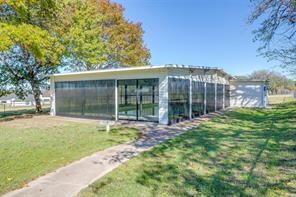 3952 Tin Top Road Weatherford, TX 76087 - Photo 5 of 39 a large tree in front of a house