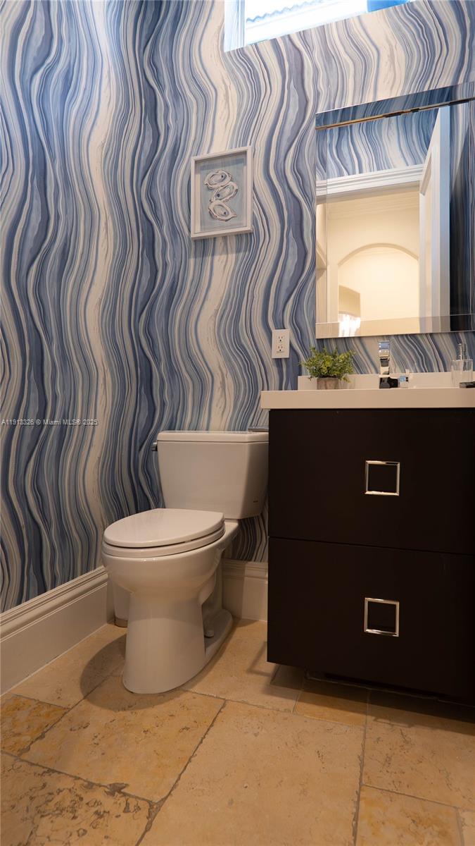 959 Eve Street Delray Beach, FL 33483 - Photo 38 of 74 a bathroom with a toilet and a sink