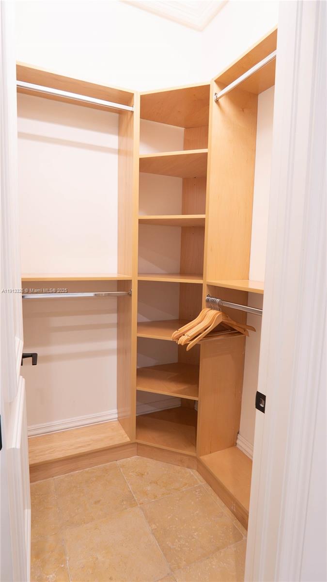 959 Eve Street Delray Beach, FL 33483 - Photo 41 of 74 a view of walk in closet with empty racks