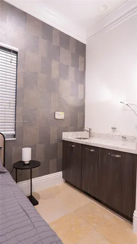 a view of a room with a table and chairs