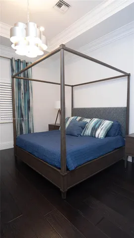 a front view of a house with swimming pool and outdoor seating