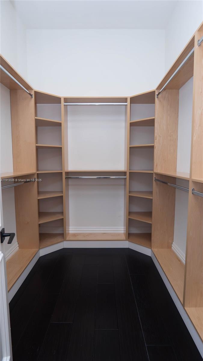 959 Eve Street Delray Beach, FL 33483 - Photo 53 of 74 a view of walk in closet with empty racks