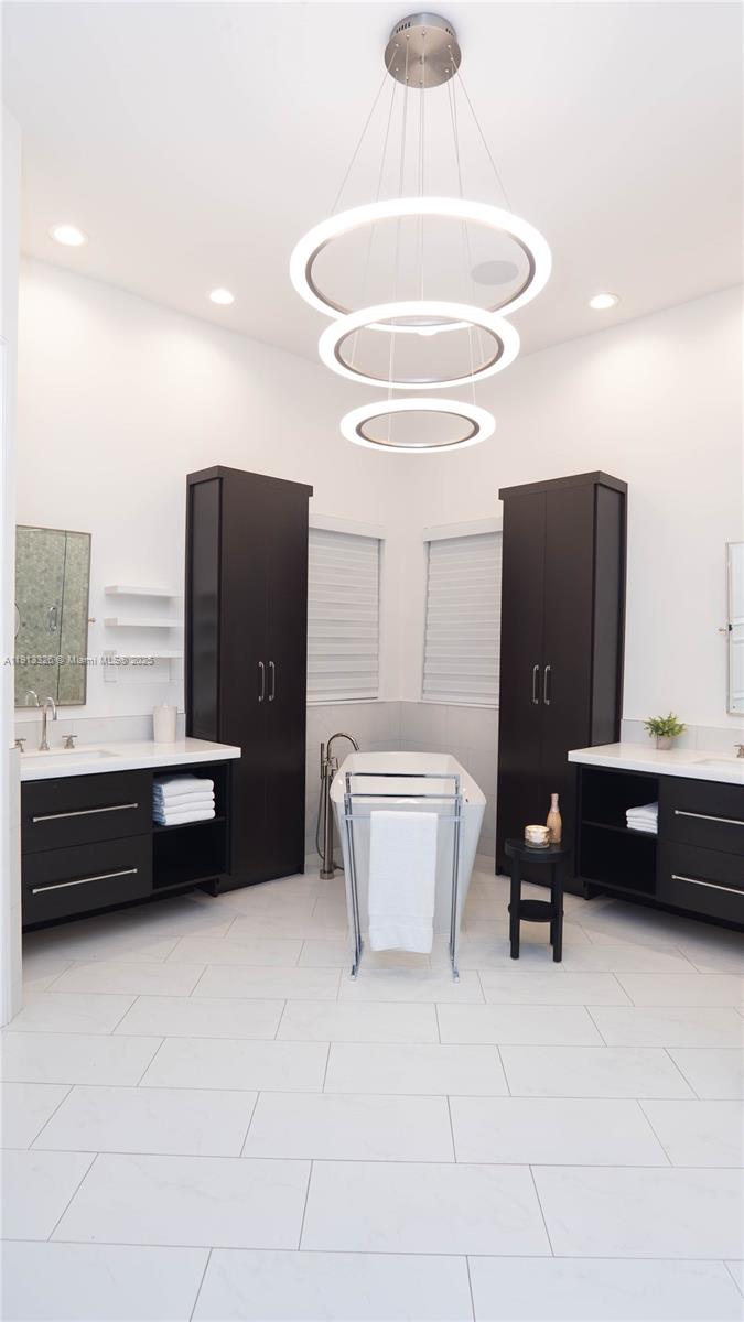 959 Eve Street Delray Beach, FL 33483 - Photo 65 of 74 a living room with furniture and a chandelier