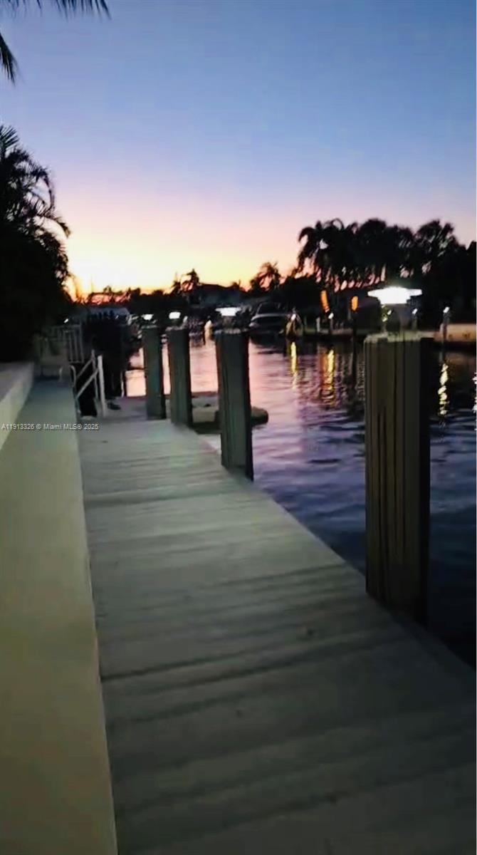 959 Eve Street Delray Beach, FL 33483 - Photo 74 of 74 a view of a balcony with wooden floor space and a potted plant