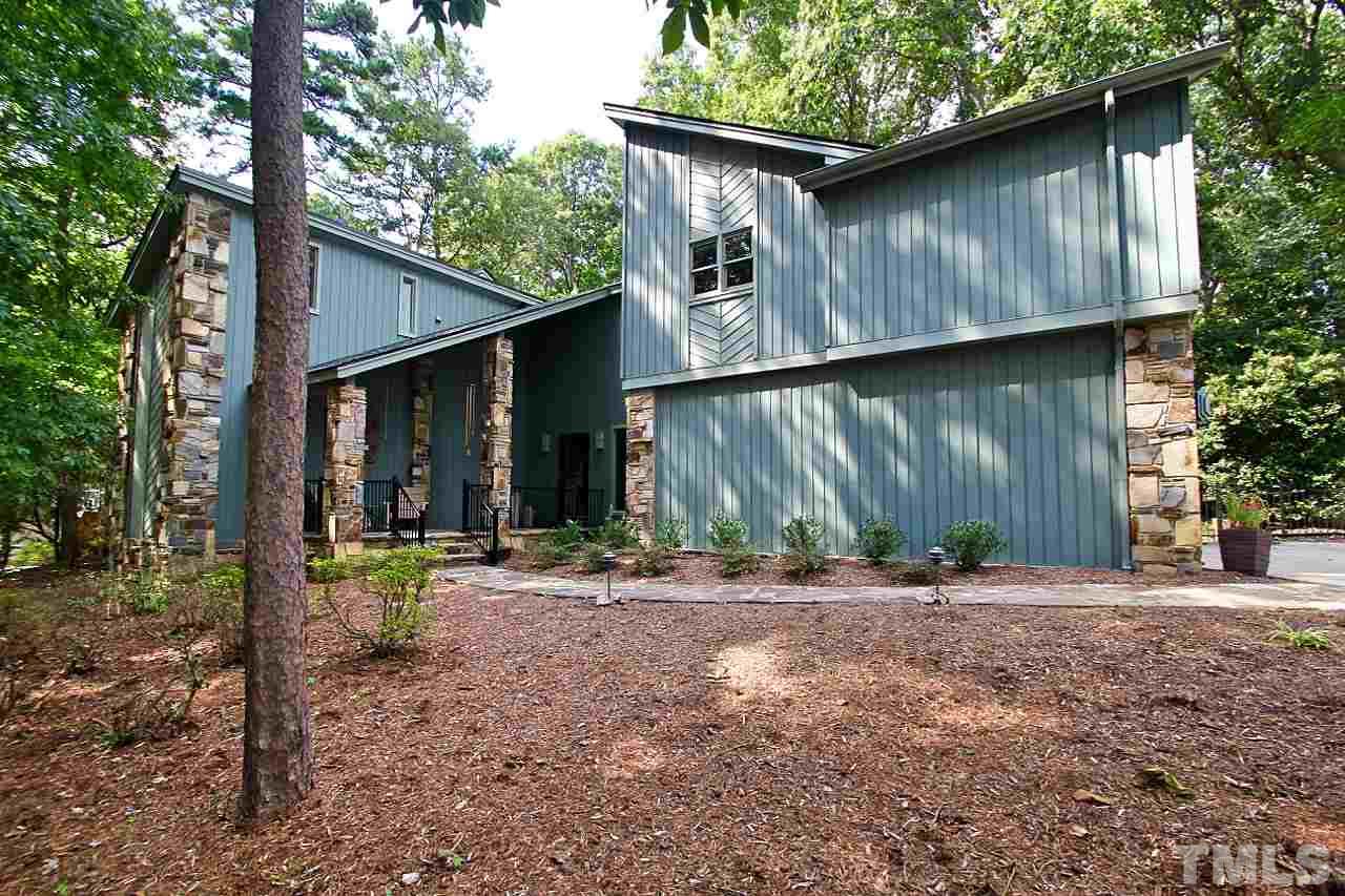 122 Queensferry Road Cary, NC 27511 - Photo 1 of 25 a backyard of a house with table and chairs