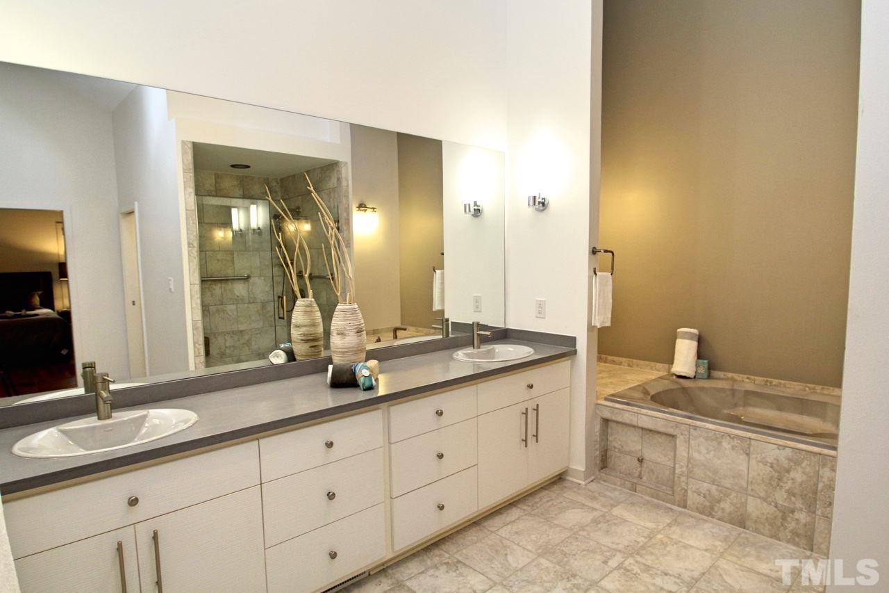 122 Queensferry Road Cary, NC 27511 - Photo 14 of 25 a bathroom with double sink and a mirror