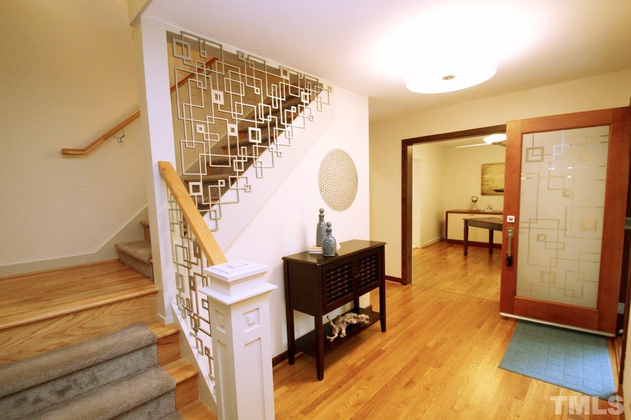 122 Queensferry Road Cary, NC 27511 - Photo 3 of 25 a view of entryway and hall with wooden floor