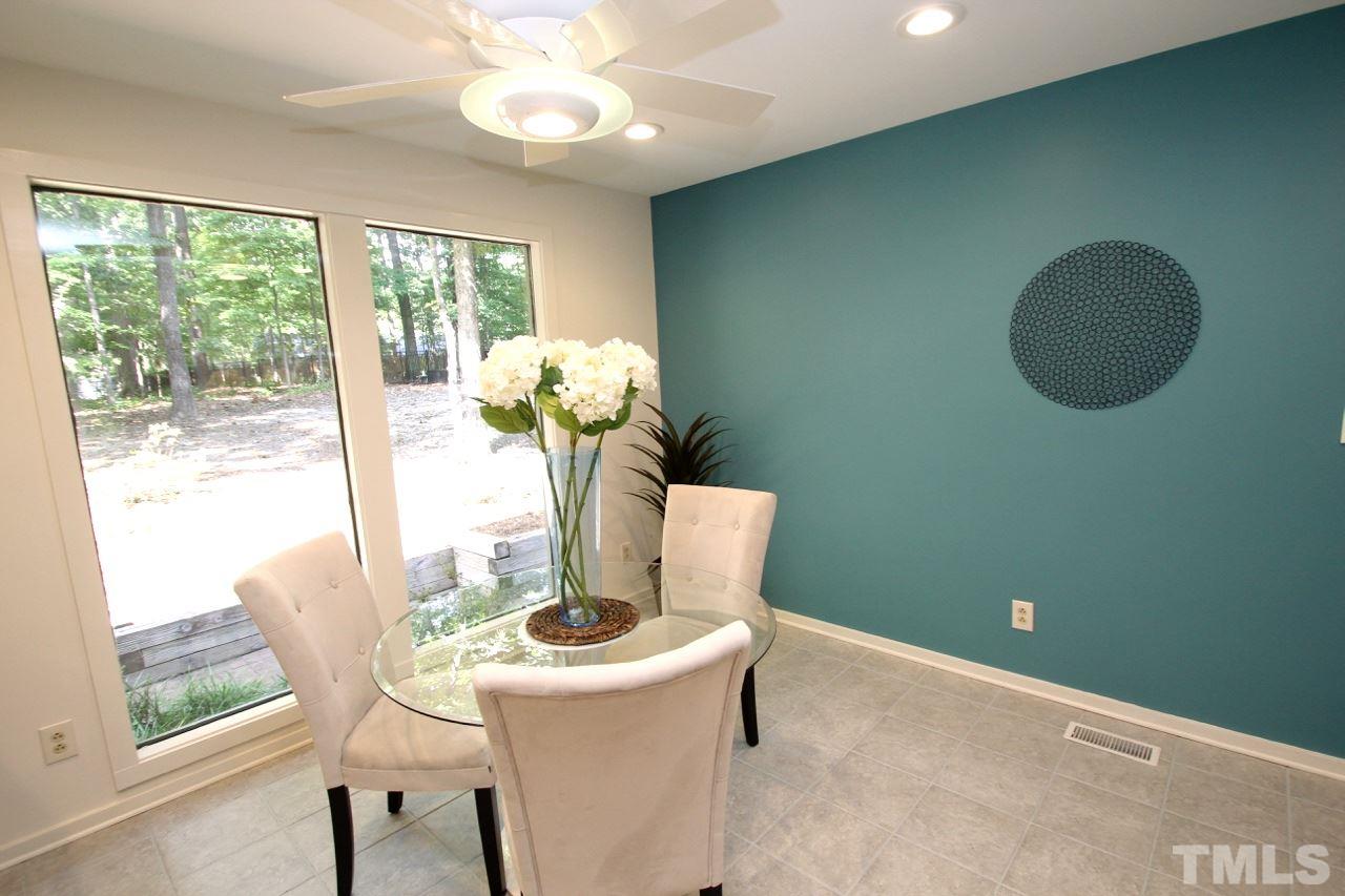 122 Queensferry Road Cary, NC 27511 - Photo 6 of 25 a view of a room with a table and chairs