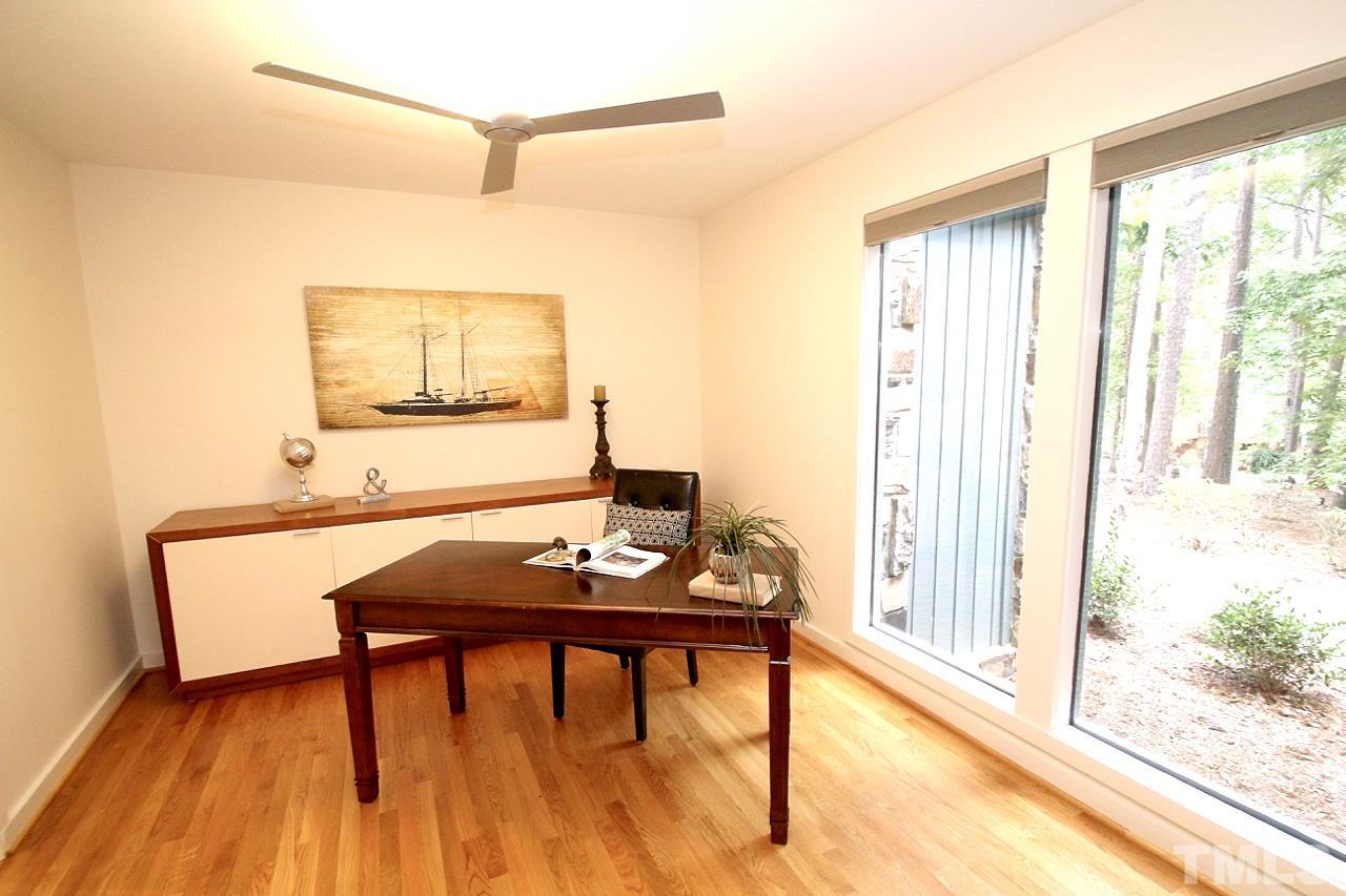 122 Queensferry Road Cary, NC 27511 - Photo 7 of 25 a view of a workspace with furniture and a window