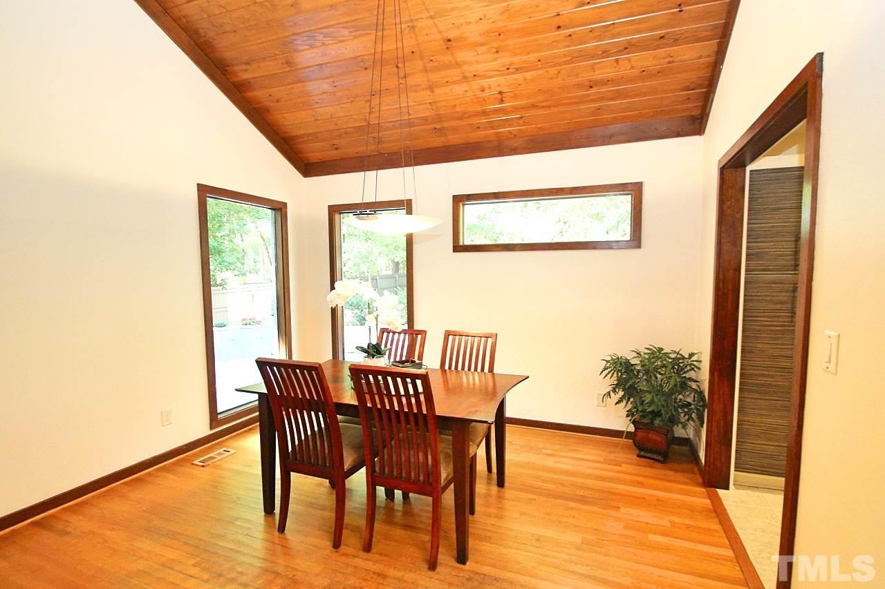 122 Queensferry Road Cary, NC 27511 - Photo 10 of 25 a dining room with furniture and wooden floor