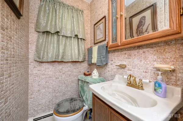 a bathroom with a sink a toilet and a sink