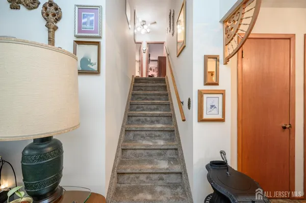 a view of a hallway with seating space