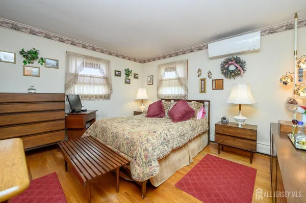 a bedroom with a bed and dresser
