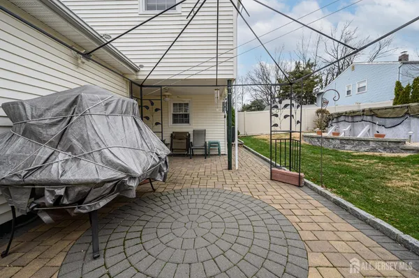 a view of a backyard with sitting area and furniture