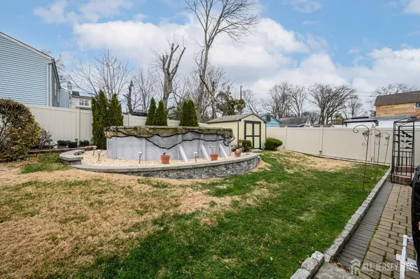 a view of a fountain in the backyard of a house
