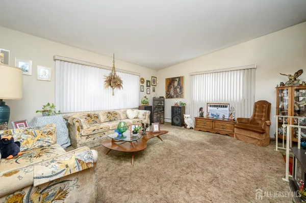 a living room with furniture and a table