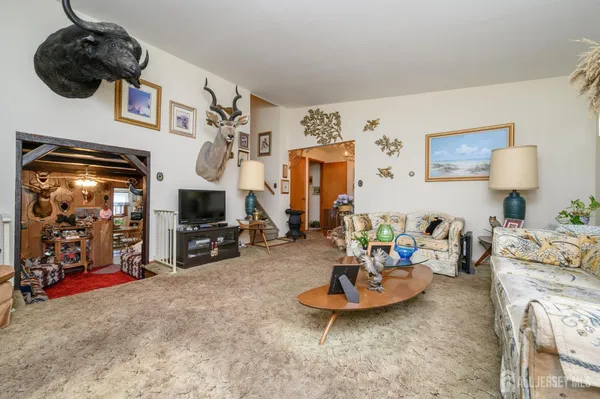 a view of a livingroom with furniture and toys