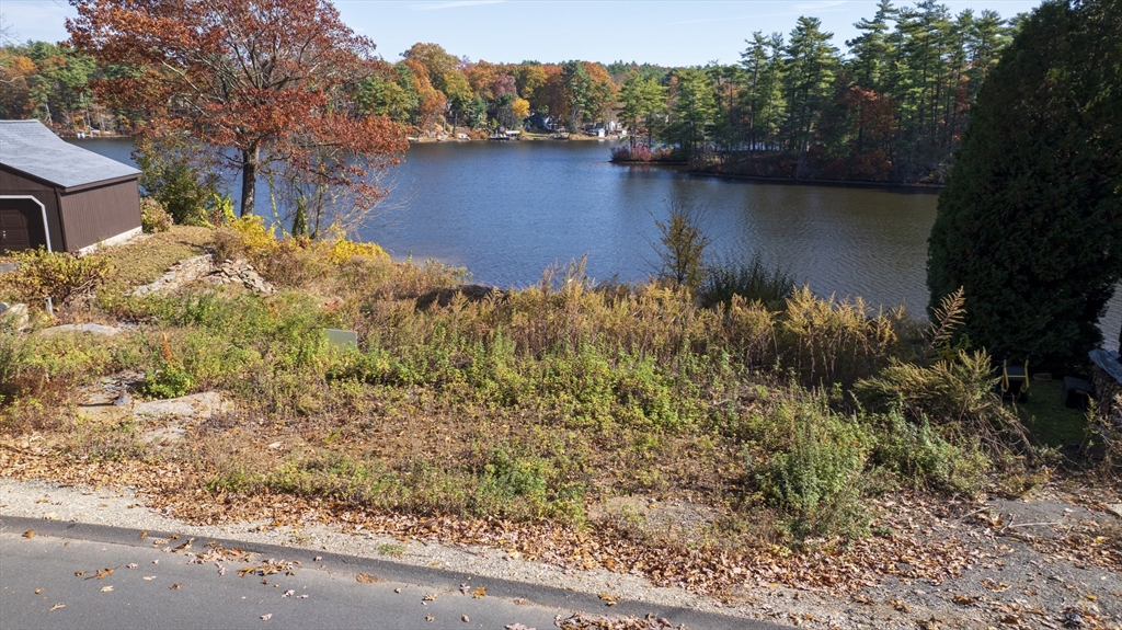 83 Sandy Beach Road Holland, MA 01521 - Photo 3 of 13 a view of lake with green landscape