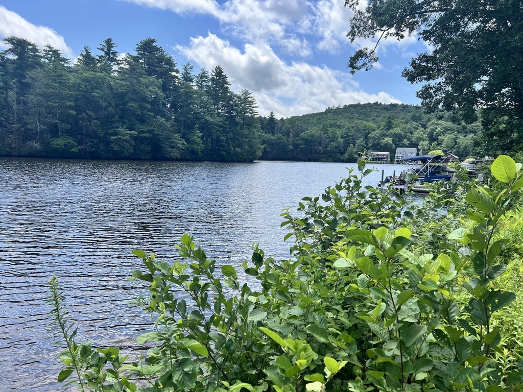 83 Sandy Beach Road Holland, MA 01521 - Photo 9 of 13 a view of a lake with houses