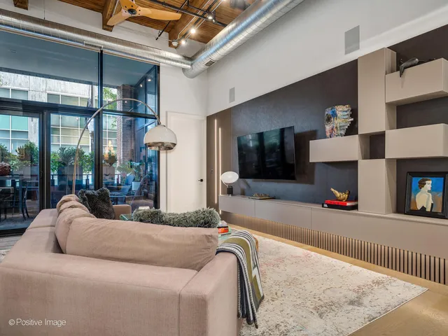 a bedroom with a bed and flat screen tv
