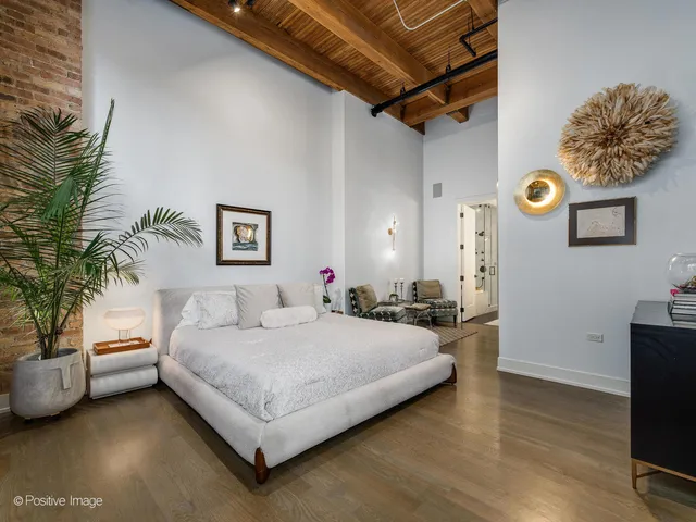 a bedroom with furniture and a window