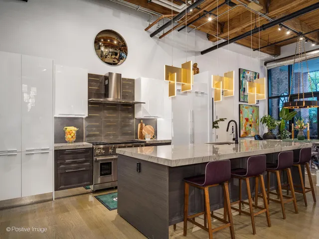 a kitchen with a stove and a refrigerator