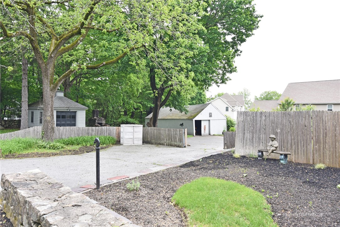 2745 Diamond Hill Road Cumberland, RI 02864 - Photo 33 of 38 Side yard with garage and barn