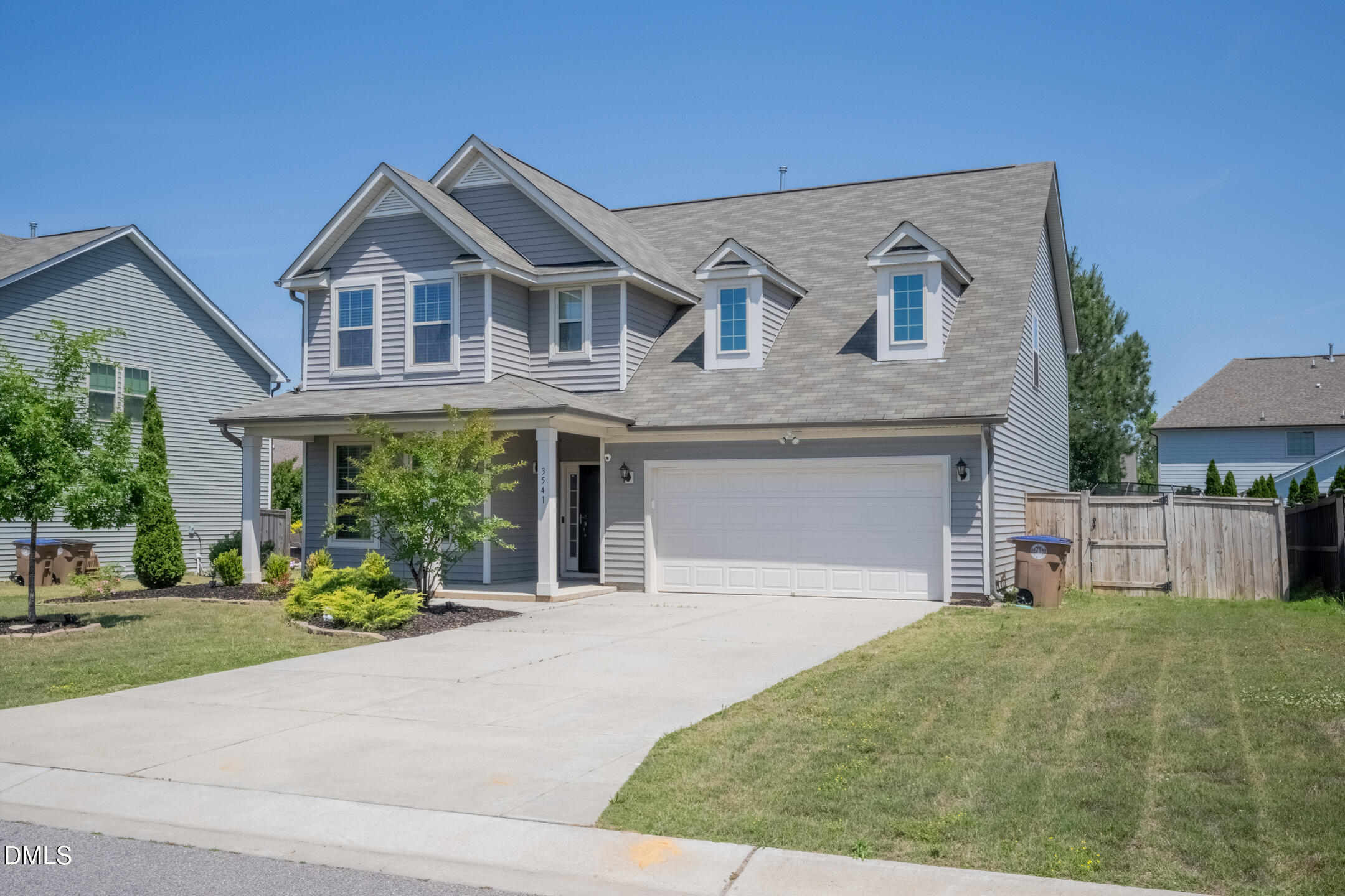 3541 Fairstone Road Wake Forest, NC 27587 - Photo 2 of 39 a front view of a house with garden and trees