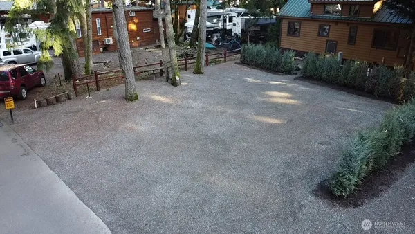 a view of a house with a yard and sitting area