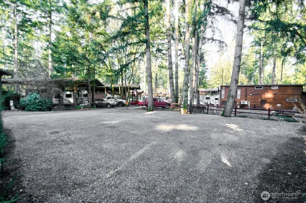 a view of road with parked cars